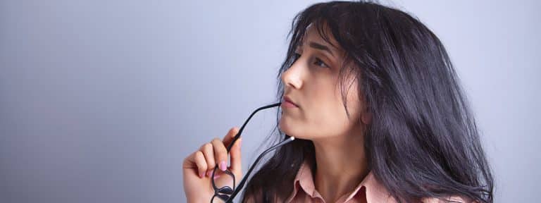 A young woman ponders