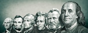 A lineup of the dollar bill portraits of Presidents.